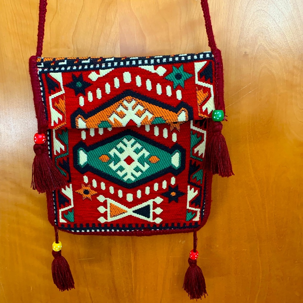 Handmade purse with tassels.